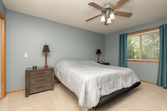 822 Emerson Ave N, Montrose, MN 55363 - bedroom featuring light colored carpet, baseboards, ceiling fan, and a textured ceiling
