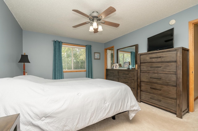 822 Emerson Ave N, Montrose, MN 55363 - bedroom featuring light colored carpet, ceiling fan, and a textured ceiling