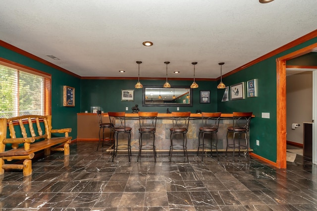 822 Emerson Ave N, Montrose, MN 55363 - indoor wet bar featuring baseboards, crown molding, marble finish flooring, pendant lighting, and recessed lighting