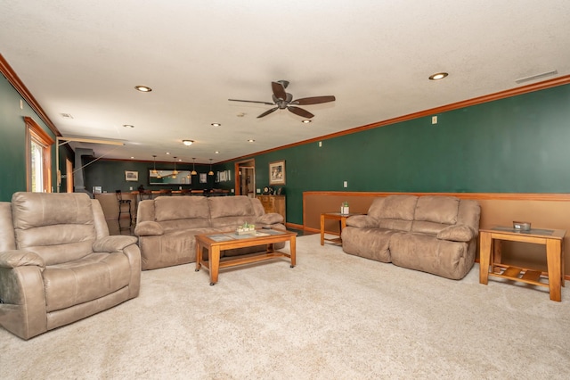 822 Emerson Ave N, Montrose, MN 55363 - carpeted living area featuring crown molding, recessed lighting, a ceiling fan, and baseboards