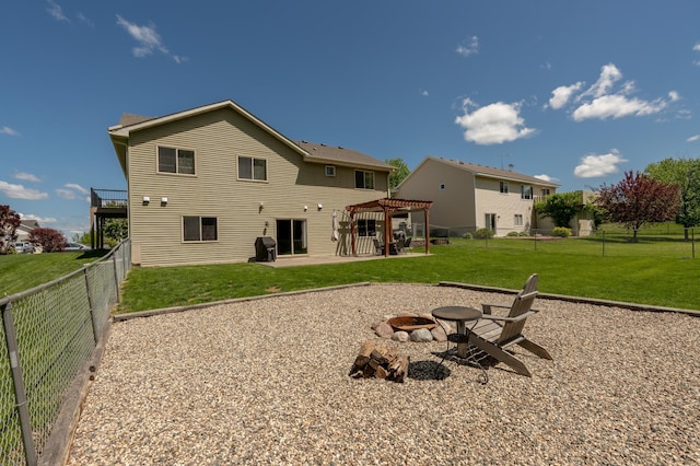 822 Emerson Ave N, Montrose, MN 55363 - rear view of property with a fire pit, a pergola, and a patio