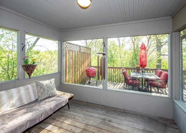 sunroom / solarium with outdoor dining space