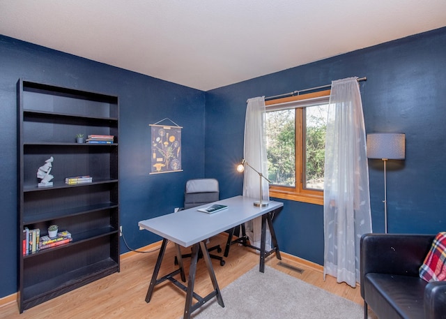 office featuring wood finished floors and baseboards