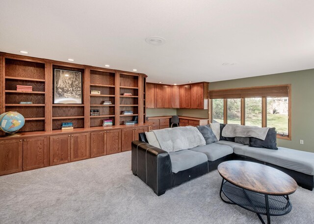 living area with recessed lighting and carpet