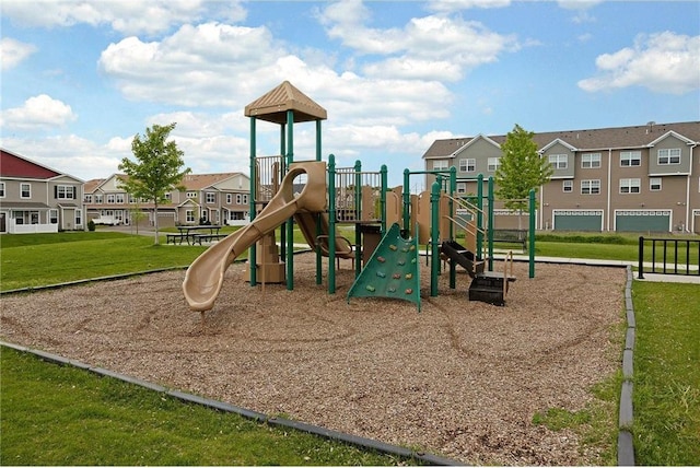 communal playground with a residential view and a yard