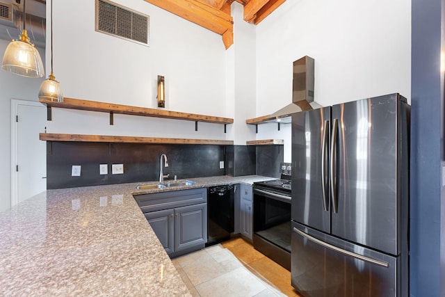 kitchen with open shelves, black appliances, a sink, wall chimney range hood, and beam ceiling