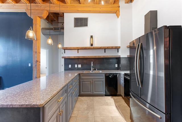 kitchen featuring freestanding refrigerator, a sink, black dishwasher, open shelves, and gray cabinets