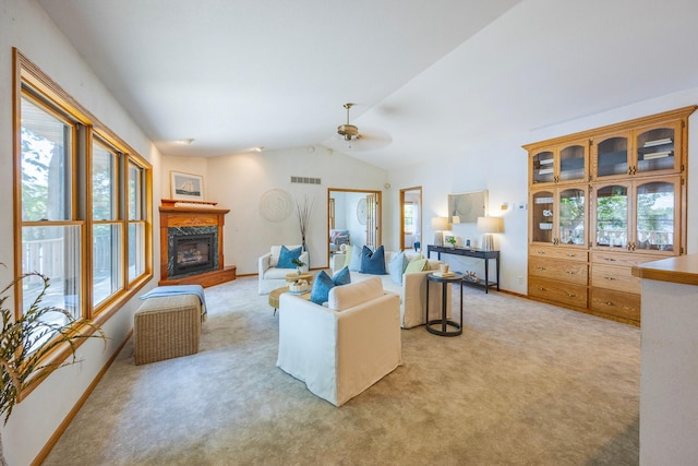 344 Barker St, Hastings, MN 55033 - living area with light carpet, healthy amount of natural light, a premium fireplace, and lofted ceiling