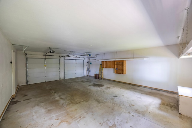 344 Barker St, Hastings, MN 55033 - garage featuring a garage door opener and baseboards