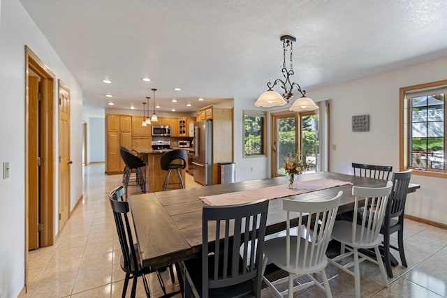 2606 Hulett Ct, Faribault, MN 55021 - dining room with light tile patterned floors, recessed lighting, and baseboards