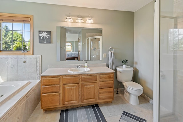 2606 Hulett Ct, Faribault, MN 55021 - bathroom with ensuite bathroom, tile patterned flooring, a stall shower, toilet, and a garden tub