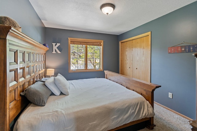 2606 Hulett Ct, Faribault, MN 55021 - carpeted bedroom with baseboards, a textured ceiling, and a closet