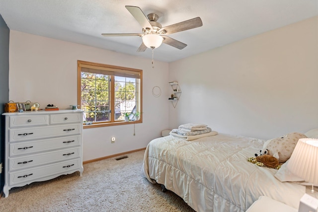 2606 Hulett Ct, Faribault, MN 55021 - bedroom with light colored carpet, baseboards, and a ceiling fan