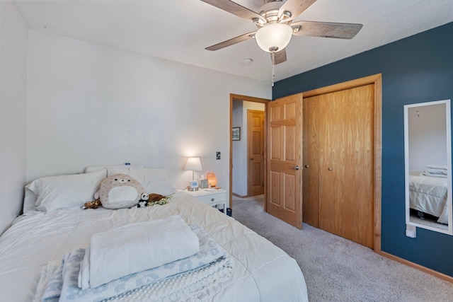 2606 Hulett Ct, Faribault, MN 55021 - bedroom featuring carpet floors, a closet, a ceiling fan, and baseboards