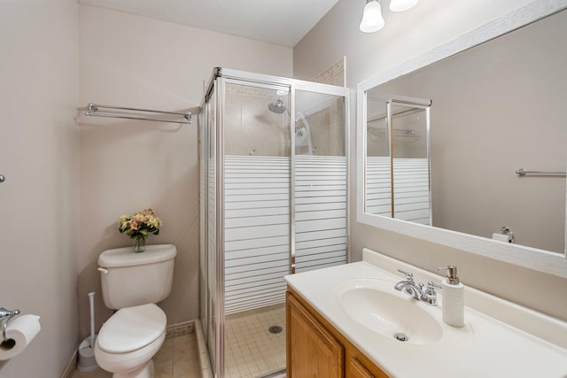 2606 Hulett Ct, Faribault, MN 55021 - full bath with a shower stall, toilet, vanity, and tile patterned flooring