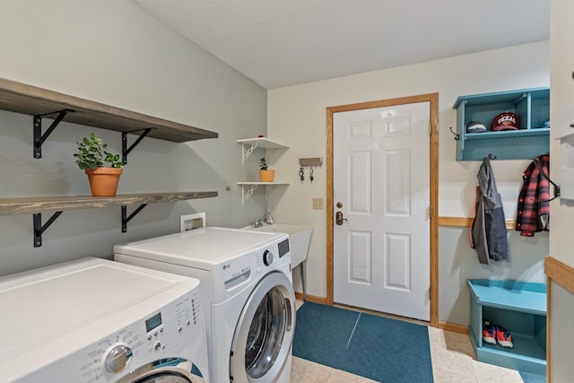 2606 Hulett Ct, Faribault, MN 55021 - washroom with separate washer and dryer, tile patterned floors, and baseboards