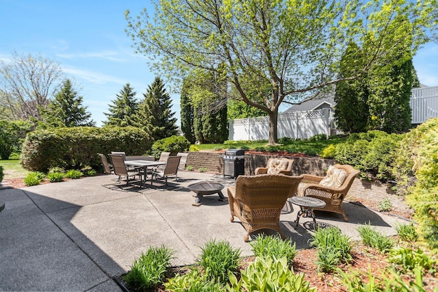 2606 Hulett Ct, Faribault, MN 55021 - view of patio with outdoor dining space, area for grilling, and fence