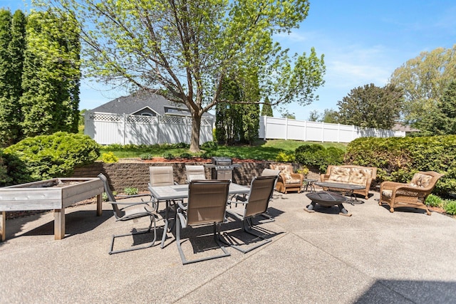 2606 Hulett Ct, Faribault, MN 55021 - view of patio with fence, outdoor dining space, and an outdoor living space with a fire pit