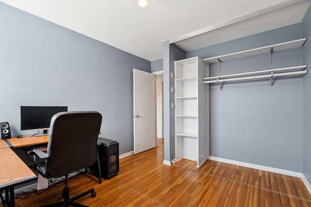 office featuring baseboards and wood finished floors