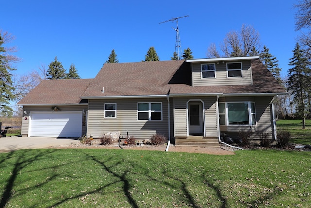 view of front of house featuring entry steps, an attached garage, and a front yard