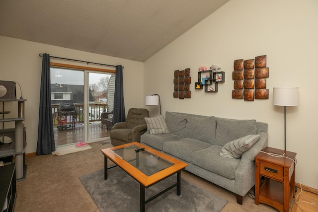 living area featuring baseboards, carpet, and vaulted ceiling