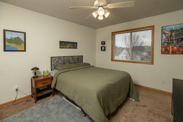 bedroom featuring baseboards, a ceiling fan, and carpet