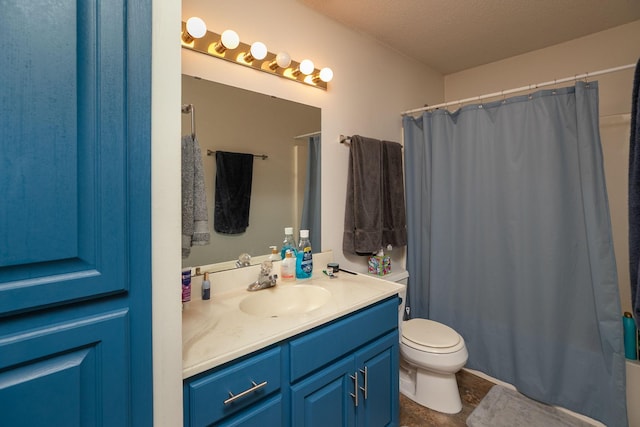 full bathroom featuring toilet, a textured ceiling, and vanity