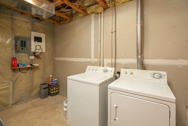 laundry room featuring laundry area, washer and clothes dryer, and electric panel