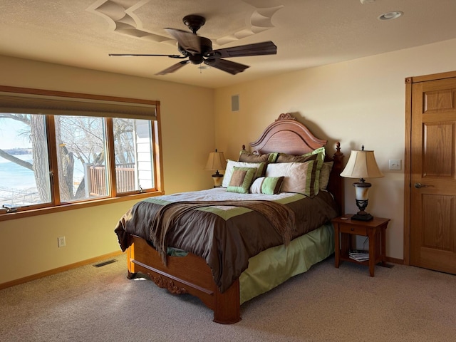 79317 355th St, Clinton, MN 56225 - carpeted bedroom featuring baseboards and ceiling fan