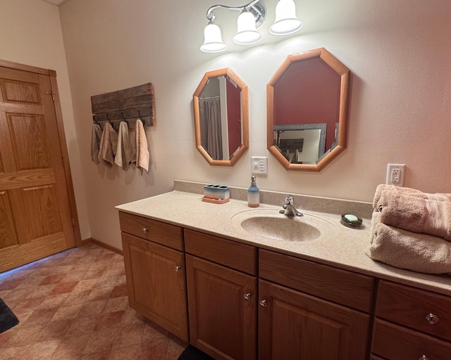 79317 355th St, Clinton, MN 56225 - bathroom featuring vanity and baseboards