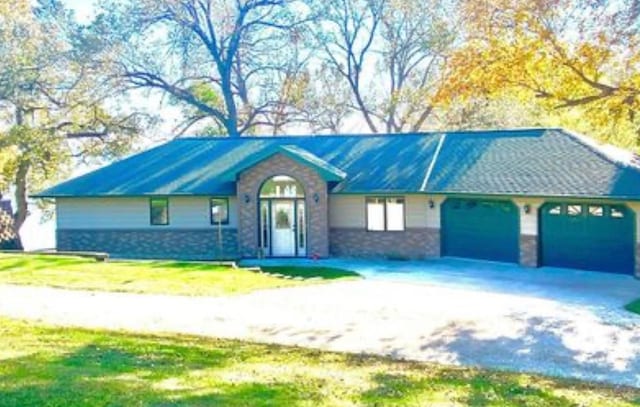 79317 355th St, Clinton, MN 56225 - ranch-style home with an attached garage, driveway, and a front lawn