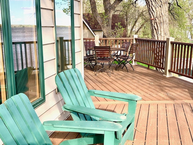 79317 355th St, Clinton, MN 56225 - wooden terrace with outdoor dining space and a water view