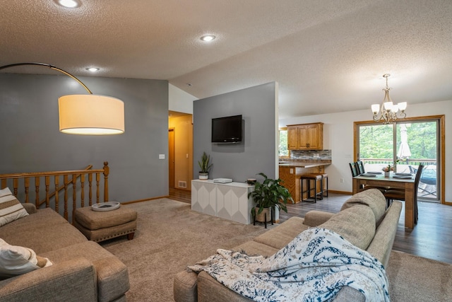 2686 56th Ave, Princeton, MN 55371 - carpeted living area with lofted ceiling, a chandelier, a textured ceiling, baseboards, and recessed lighting