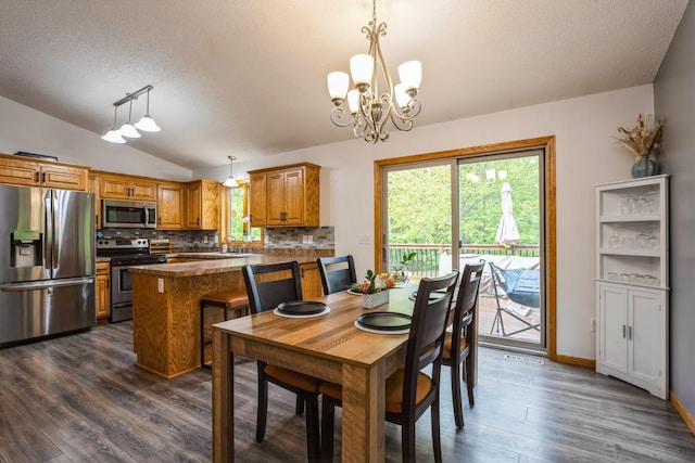 2686 56th Ave, Princeton, MN 55371 - dining space featuring a textured ceiling, lofted ceiling, a chandelier, dark wood finished floors, and baseboards