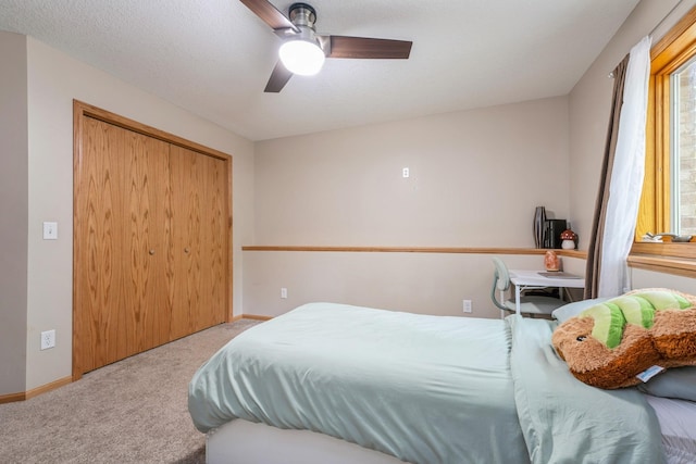 2686 56th Ave, Princeton, MN 55371 - bedroom featuring carpet, a closet, baseboards, and a ceiling fan