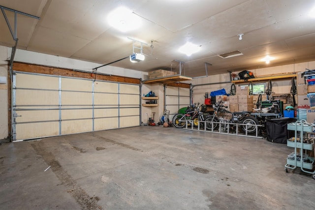2686 56th Ave, Princeton, MN 55371 - garage featuring a garage door opener