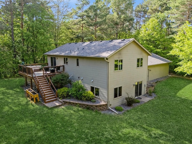 2686 56th Ave, Princeton, MN 55371 - back of house with stairway, roof with shingles, a wooden deck, and a lawn