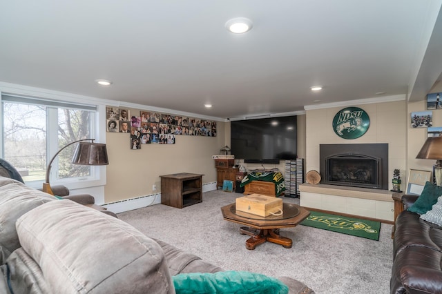 118 Golf Ter, Crookston, MN 56716 - living room featuring baseboard heating, carpet floors, a tile fireplace, a baseboard heating unit, and ornamental molding