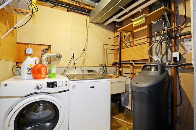 laundry area with separate washer and dryer and laundry area