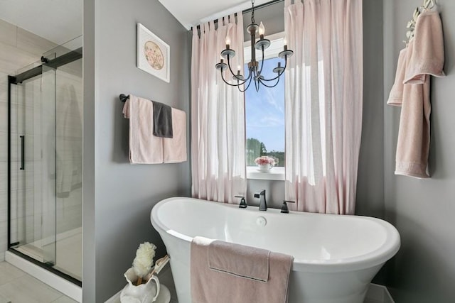 23892 187th St NW, Big Lake, MN 55309 - bathroom featuring a chandelier, a stall shower, and a freestanding bath