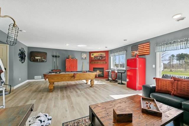 23892 187th St NW, Big Lake, MN 55309 - playroom featuring billiards table, plenty of natural light, wood finished floors, and recessed lighting