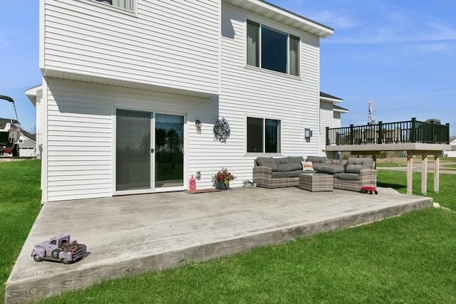 23892 187th St NW, Big Lake, MN 55309 - back of property featuring a patio, a lawn, a deck, and an outdoor living space