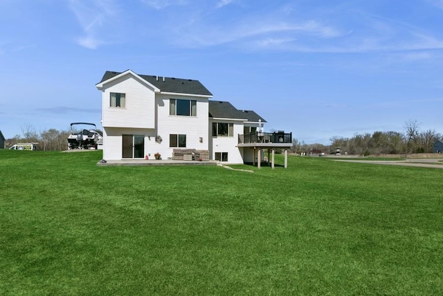 23892 187th St NW, Big Lake, MN 55309 - rear view of house with a yard, a wooden deck, and a patio area