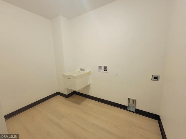 laundry room with laundry area, hookup for a washing machine, baseboards, wood finished floors, and hookup for an electric dryer