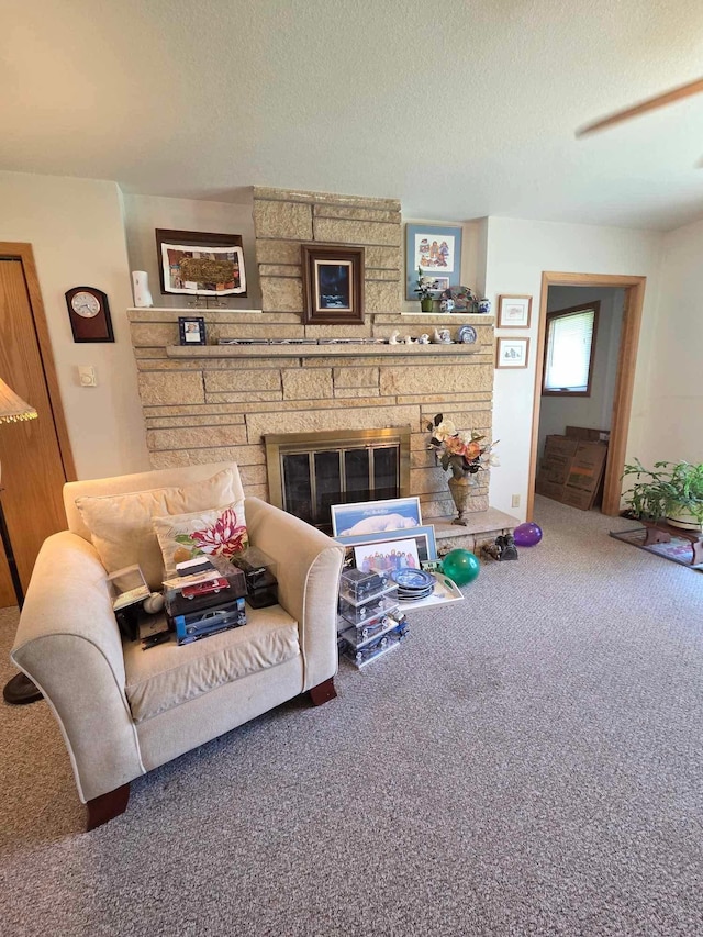 313 Saehler Dr, Goodview, MN 55959 - living area featuring carpet flooring, a fireplace, and a textured ceiling