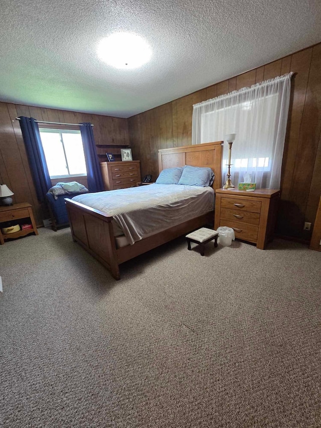 313 Saehler Dr, Goodview, MN 55959 - bedroom featuring carpet flooring, wood walls, and a textured ceiling