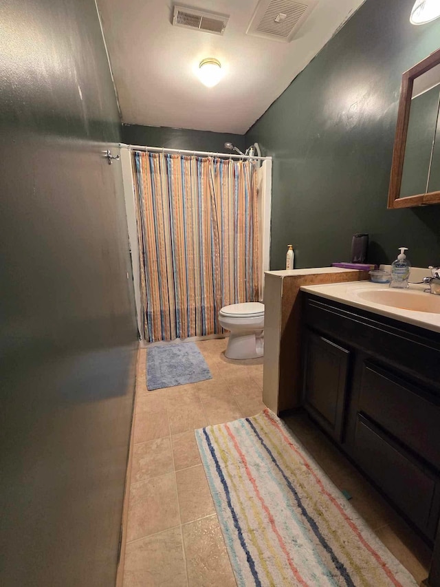 313 Saehler Dr, Goodview, MN 55959 - full bathroom featuring toilet, tile patterned floors, a shower with curtain, and visible vents
