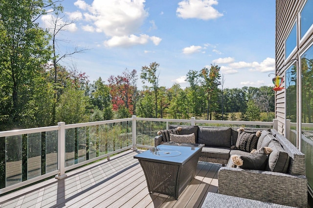 wooden terrace featuring outdoor lounge area