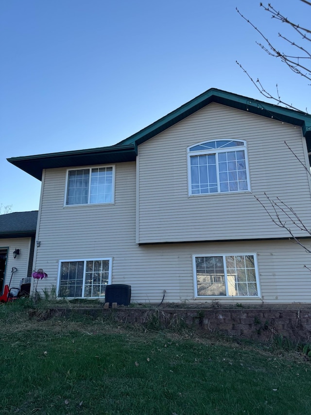 view of property exterior featuring a yard