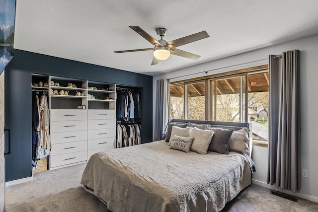 bedroom featuring visible vents, carpet flooring, and baseboards